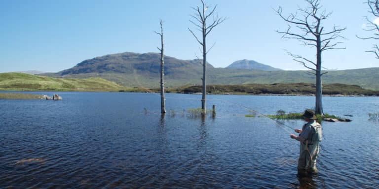 man fishing in Assynt loch