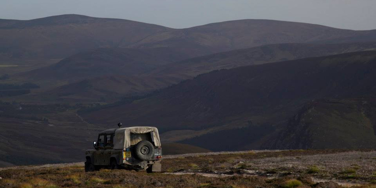 gamekeepers soft top land rover on hill track on Scottish grouse moor