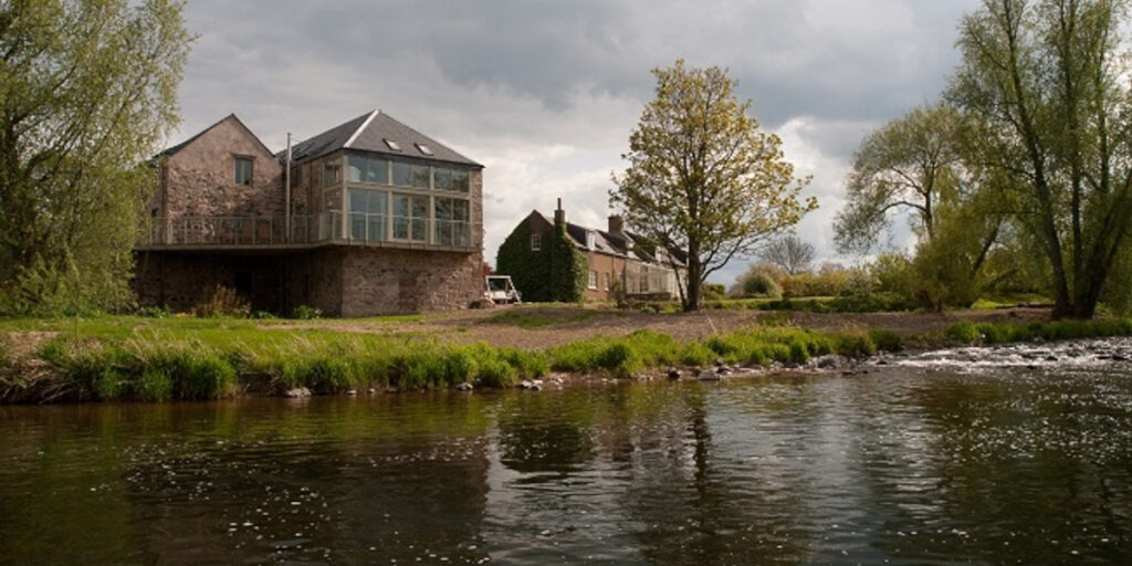 converted mill house beside river