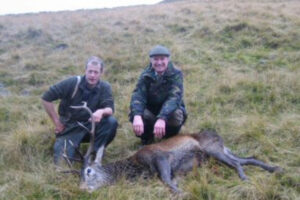 Invercauld_estate_2_stalkers_with_red_deer_stag_Scottish_Hill
