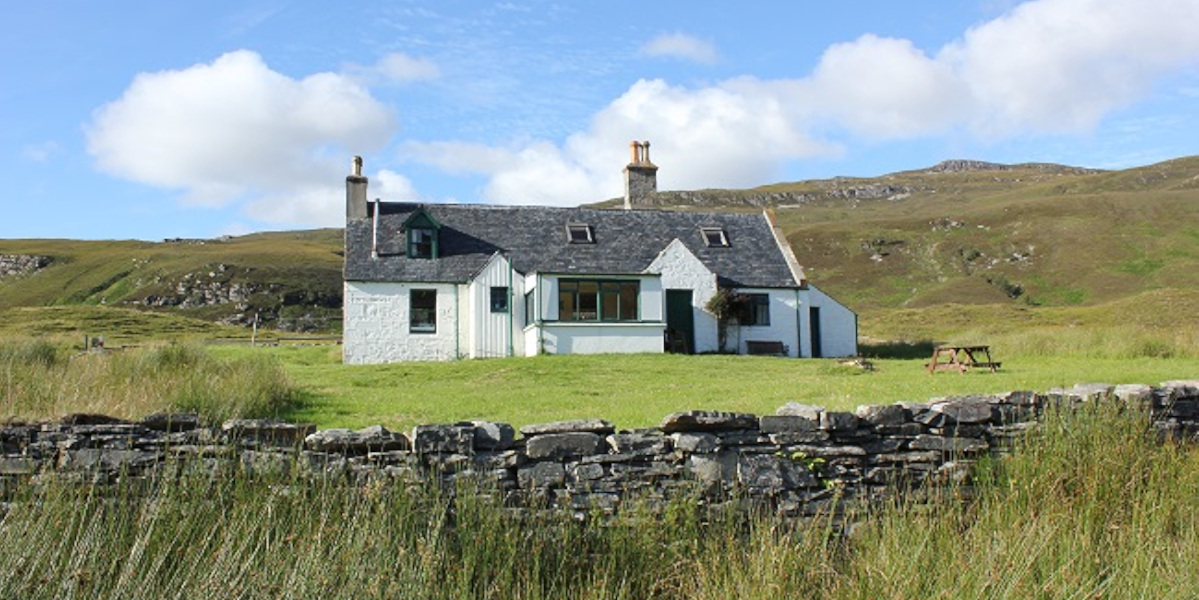 Scottish highland cottage on hillside