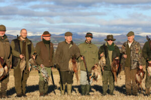 team of game bird guns with pheasants