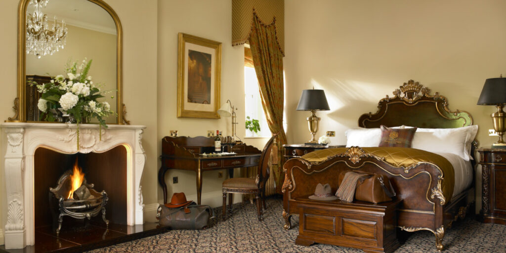 Luxury hotel room with open fire and writing desk