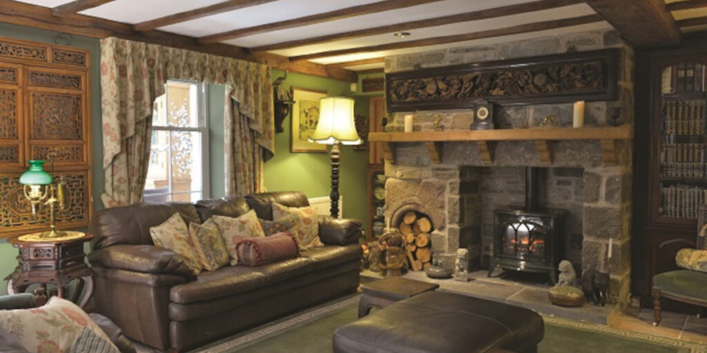 lounge with sofas and woodburner