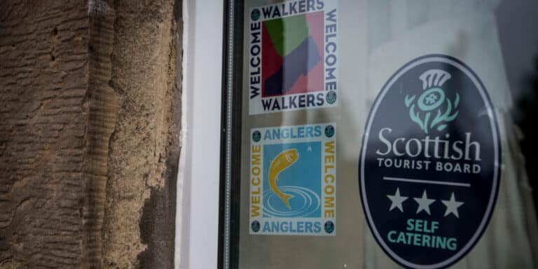 window with VS accreditation stickers