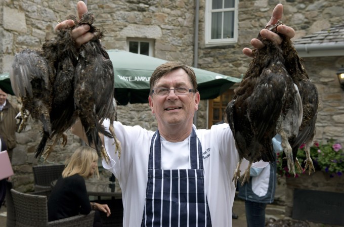 chef holding grouse