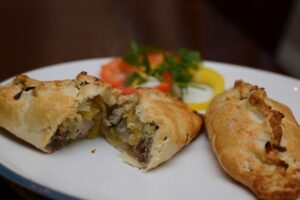 2 pheasant pasties on a plate