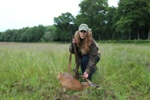 woman with deer carcass