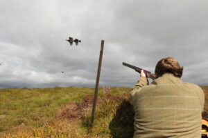 man shooting grouse