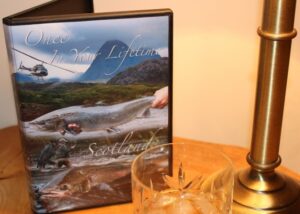 dvd cover and glass on a table