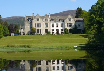 Scottish country house overlooking large pond