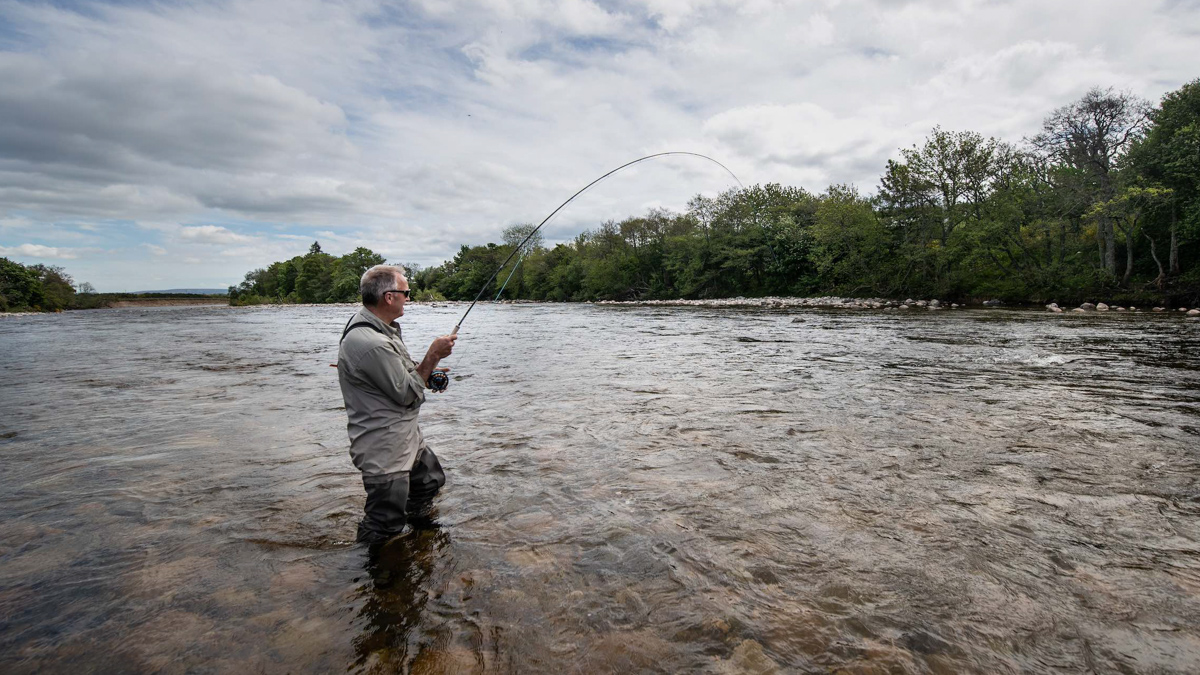 Man catches fish river dee copy LOWRES